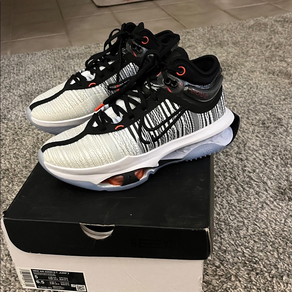 Nike young boys Black and White Athletic Shoes with Orange Accents
BRAND NEW!